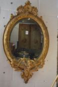 A good 19th century gilt framed oval three branch girandole.