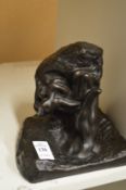 A bronze resin sculpture.