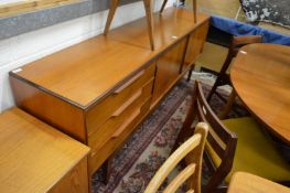 A teak long sideboard.