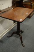 A 19th century mahogany tripod occasional table.