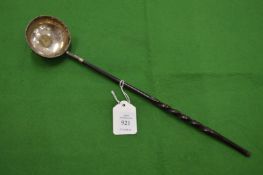 A coin inset silver toddy ladle.