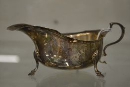 A silver sauce boat.