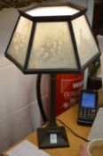 An unusual table lamp, the shade made with porcelain lithophane.