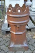 A large salt glazed chimney pot.