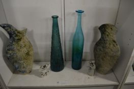 Stylish pottery vases, cat ornaments and glass bottles.