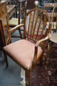 Two mahogany dining chairs (faults).
