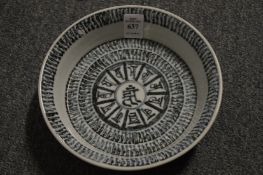 A Chinese circular blue and white bowl.