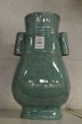A Chinese torquoise glazed twin handled pottery vase.