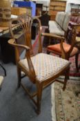 A set of eight mahogany dining chairs, two with arms all with upholstered drop-in seats.