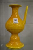 A Chinese yellow glazed pedestal ewer.