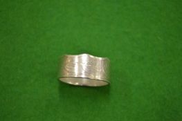 A Commonwealth 50p piece coin ring size Y½.