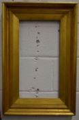 A moulded gilt wood frame, rebate size 52cm x 28cm.