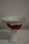 A Chinese small pedestal cup.