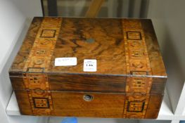 A Victorian walnut sewing box.