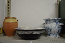 A large blue and white glazed twin handled earthenware pot, terracotta jar and other items.