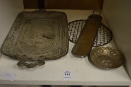 A filigree tray and other metalware.