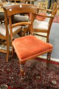 A pair of Victorian mahogany dining chairs.