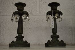 A pair of bronze candle lustres.