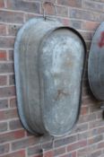 A large galvanised twin handled tub or planter.