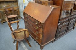 A George III oak bureau.