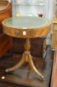 A small reproduction mahogany drum table.