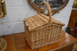 A wicker picnic basket.