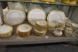 A quantity of gilt decorated tea cups and saucers.