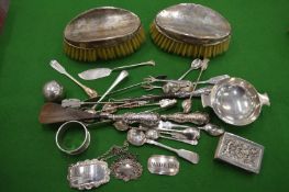 A collection of silverware to include decanter labels, pedestal bowl, brushes etc.