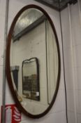 Two mahogany framed mirrors.