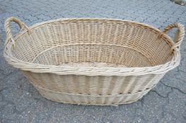 A large wicker twin handled basket.
