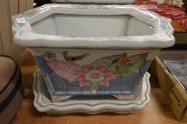 A pair of large Chinese style pottery jardinieres and stands.