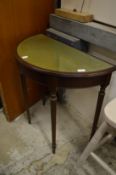 A demi lune table.