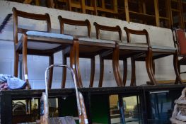A set of four mahogany dining chairs.