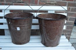 Two enamel buckets.