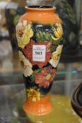 A Moorcroft collection club Victorian design tapering vase.