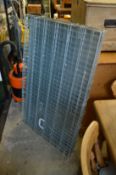 A galvanised dog cage.