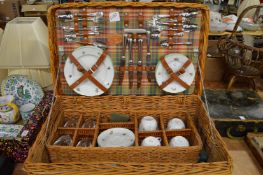 A good wicker picnic basket and contents.