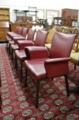 A good set of six Italian red leather upholstered reclining dining chairs with arms.