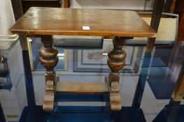 A miniature oak refectory table.