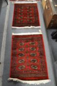 Two small Bokara rugs 90cm x 66cm and 95cm x 66cm.