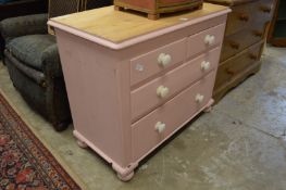 A pine chest of drawers.