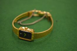 A ladies wrist watch.