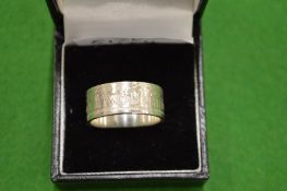 A 1954 coin ring size V.