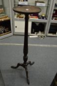 A mahogany tripod jardiniere stand.