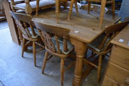 A pine kitchen table.