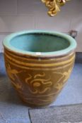 A good large Chinese earthenware jardiniere decorated with dragons.