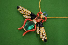 A large highly ornate bee shaped pendant and chain, signed Uter Que.