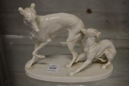 After P J Mene, a porcelain model of two whippets.