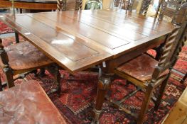 A walnut drawer leaf dining table.