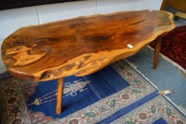 A solid yew wood plank top coffee table.